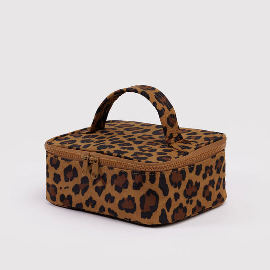 Leopard print makeup bag with a handle on a light gray background
