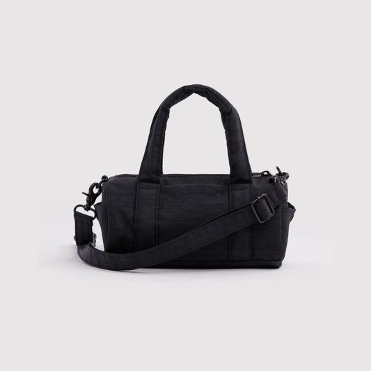 A black nylon duffel bag with dual top handles and an adjustable shoulder strap, shown against a plain white background.