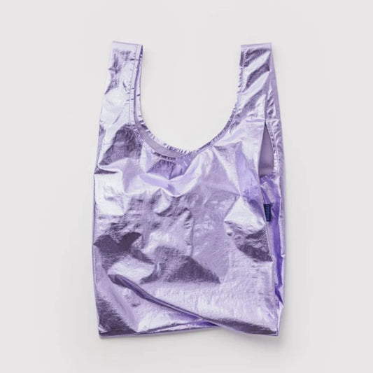 A metallic lavender reusable shopping bag with a crinkled, reflective finish, laid flat against a light gray background.
