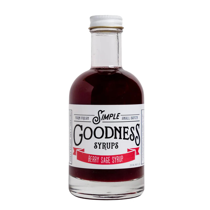 Bottle of Simple Goodness Syrups Berry Sage Syrup. Syrup is a rich red color