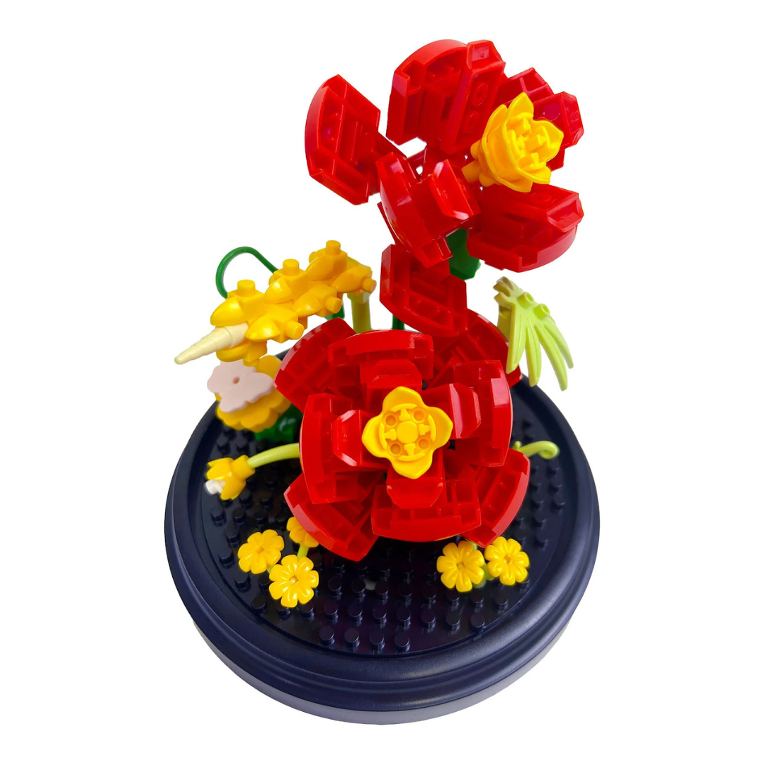 Toy block flower arrangement made of interlocking bricks on a white background