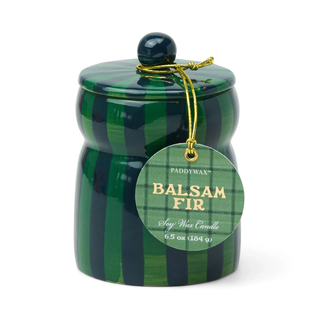 Candle in a dark green and navy striped ceramic vessel with lid. Lid has a navy knob. Tag reads "Paddywax Balsam Fir Soy Wax Candle"