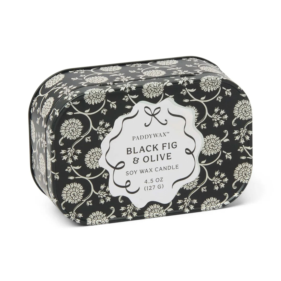 Candle tin with a black and gray floral design says "Paddywax Black Fig & Olive soy wax candle"