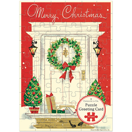 Christmas-themed puzzle greeting card with a wreath, trees, and presents on a red background.