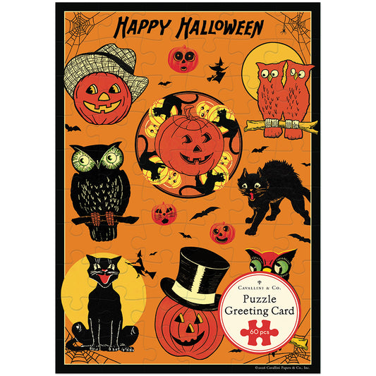 A Halloween-themed jigsaw puzzle card titled 'Happy Halloween' with illustrated pumpkins, owls, a black cat, bats, spiders, and a moon on an orange background. A circular label at the lower right reads 'Collins & Co Puzzle Greeting Card 60 pieces.