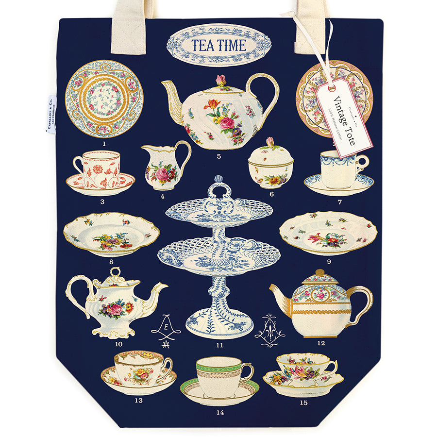 Navy tote bag with vintage tea time design featuring teapots, cups, and plates on a white background.
