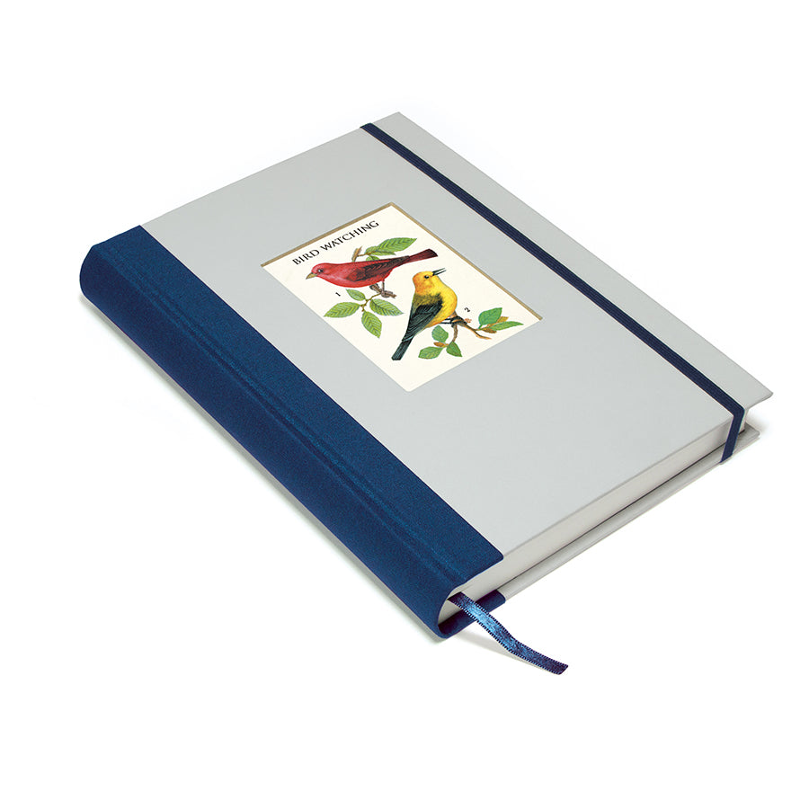 Notebook with bird illustration on the cover against a white background