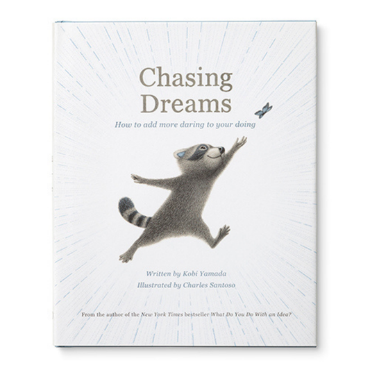 Cover for "Chasing Dreams; How to add more daring to your doing" Written by Kobi Yamada Illustrated by Charles Santoso 
From the author of the New York Times bestseller "What Do You Do With an Idea?"
The central image is a smiling raccoon chasing a butterfly, ray like lines radiate from the raccoon out to the edges of the cover.