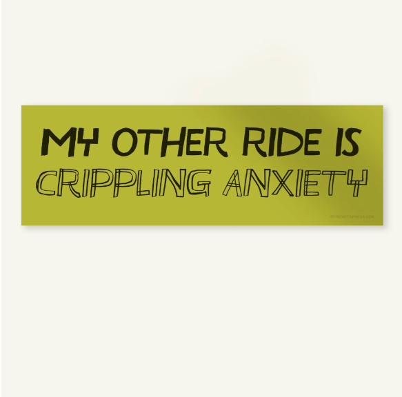 A rectangular bumper sticker with a muted olive green background and black text that reads 'MY OTHER RIDE IS CRIPPLING ANXIETY' in a hand-drawn outline font, shown against a plain off-white background.