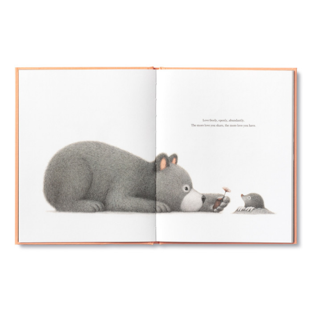 Page from "Being Kind"- the bear crouches down to make himself not threatening reaching out to offer a flower to a mole poking their head out of a hole.