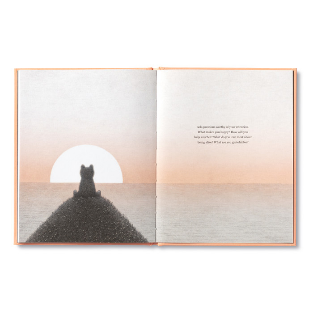 Page from "Being Kind"- the bear sits in silhouette upon a hill looking out on the sun setting over the water
