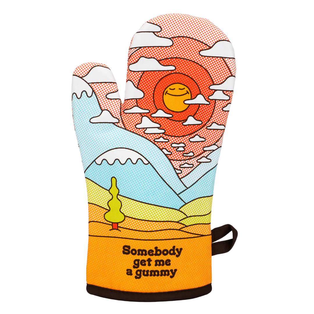 Oven mitt with a colorful design of a sun, mountains, and a character, with text 'Somebody get me a gummy'.