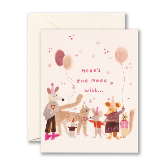 Birthday card with an illustration of animals in party hats with balloons. "Here's one more wish..."