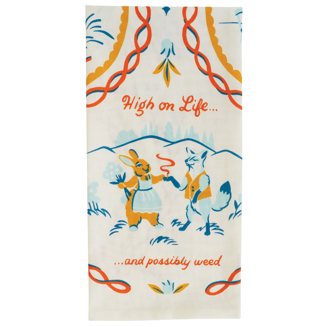 Folded tea towel featuring a happy smoking fox an rabbit that says "High on life... and possibly weed."