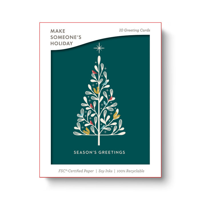 Packaging of 'Make Someone's Holiday' greeting cards with a Christmas tree design on a teal background.