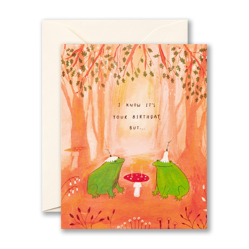 Greeting card with two frogs and a mushroom in a forest setting, featuring text.