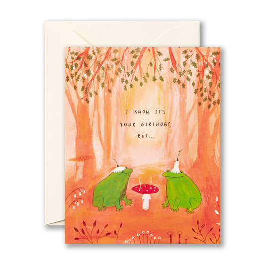 Greeting card with two frogs and a mushroom in a forest setting, featuring text.