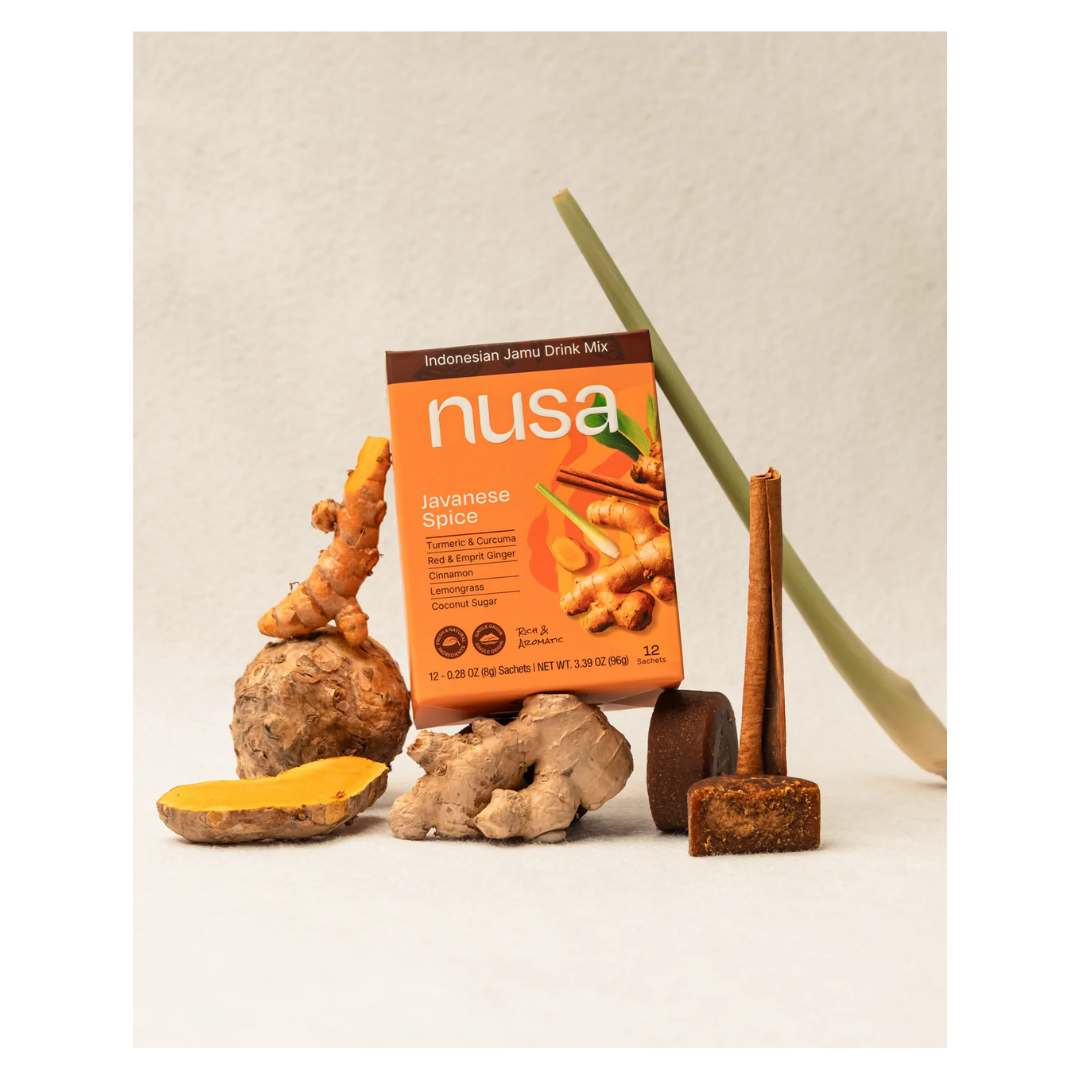 Nusa Javanese Spice drink mix package with turmeric and ginger on a neutral background.