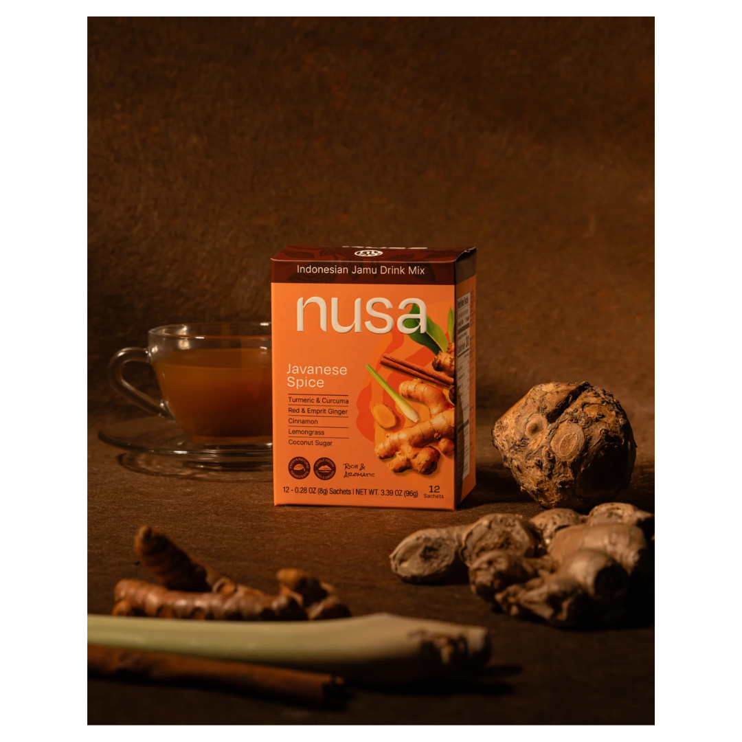 Nusa Indonesian Jemu Drink Mix box with a cup of tea and spices.