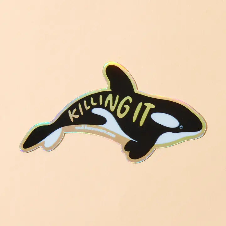 Orca whale sticker with 'KILLING IT' text on a beige background
