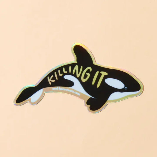 Orca whale sticker with 'KILLING IT' text on a beige background