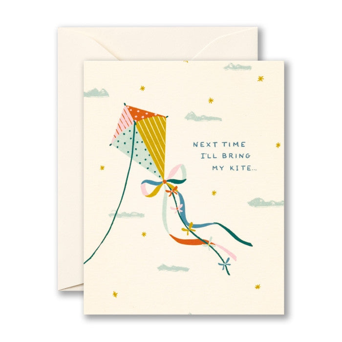 Greeting card with a colorful kite illustration and text on a white background