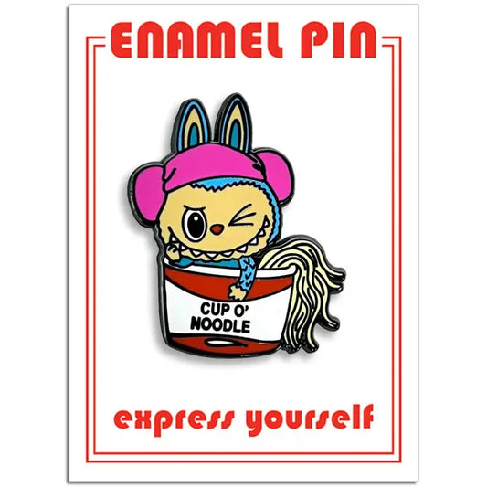 Enamel pin with cartoon character in a Cup O' Noodle container on a white background with red text.