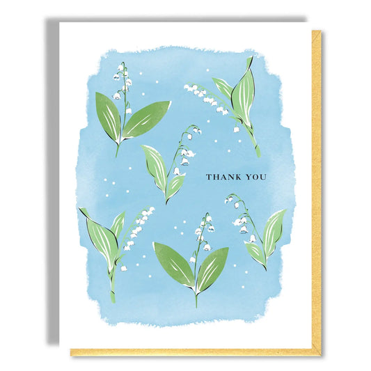 Greeting card with floral design and 'Thank You' text on a blue background
