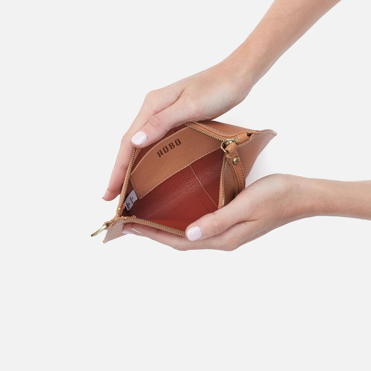 Inside of Vida small pouch is a deep tan with a credit card pocket