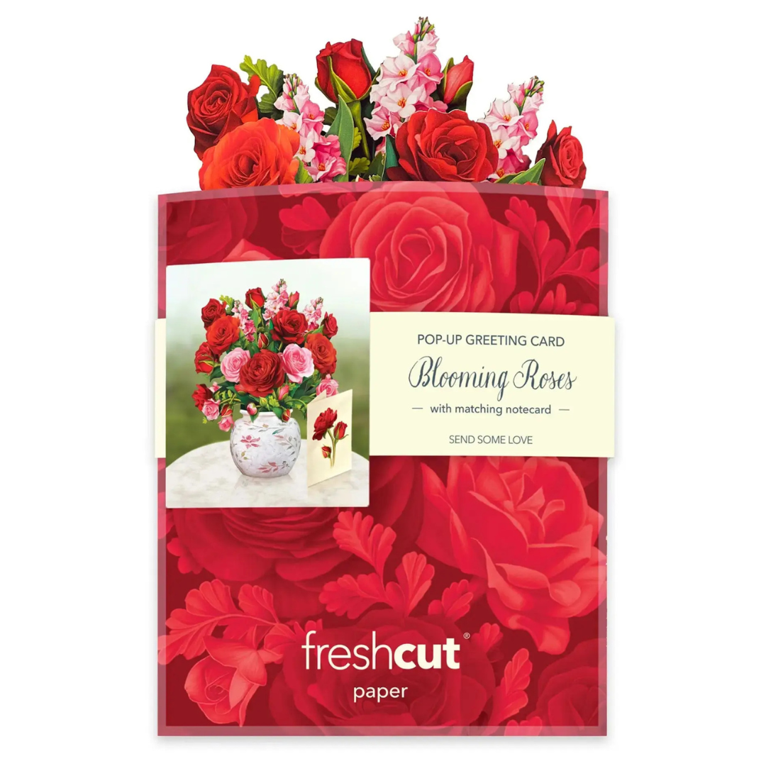 Paper Floral gift set with red roses, pop-up greeting card, and notepad on a white background.