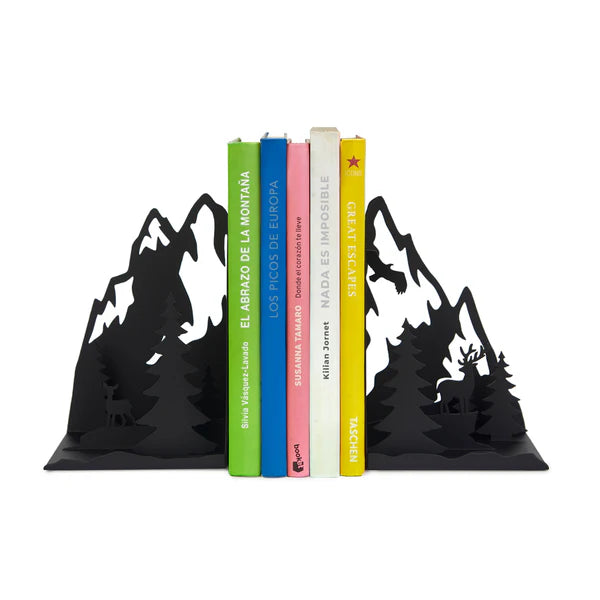 Set of bookends that look like mountains with silhouettes of trees and deer in the foreground