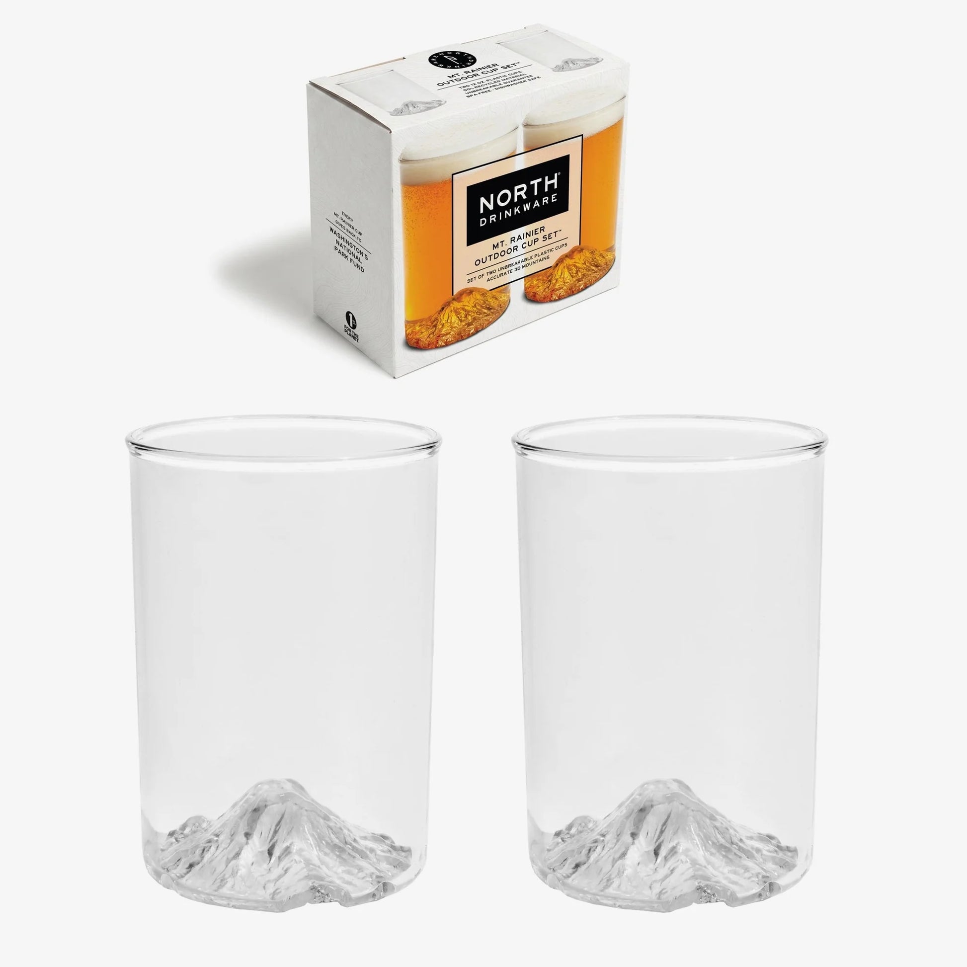 Two clear glass tumblers with a gray mountain design at the base, shown below a white North Drinkware packaging box on a light gray background.