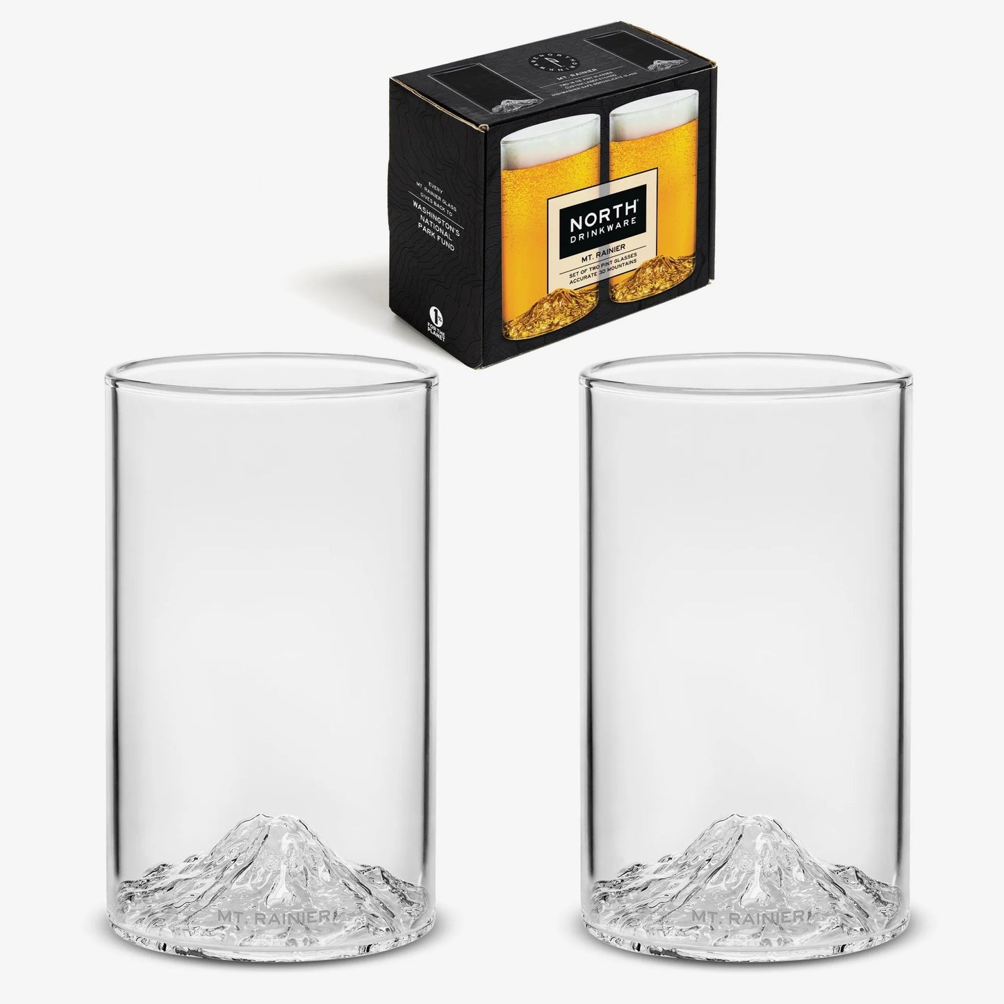 Two clear pint drinking glasses with a Mount Rainier shaped base, shown alongside their black retail box. 