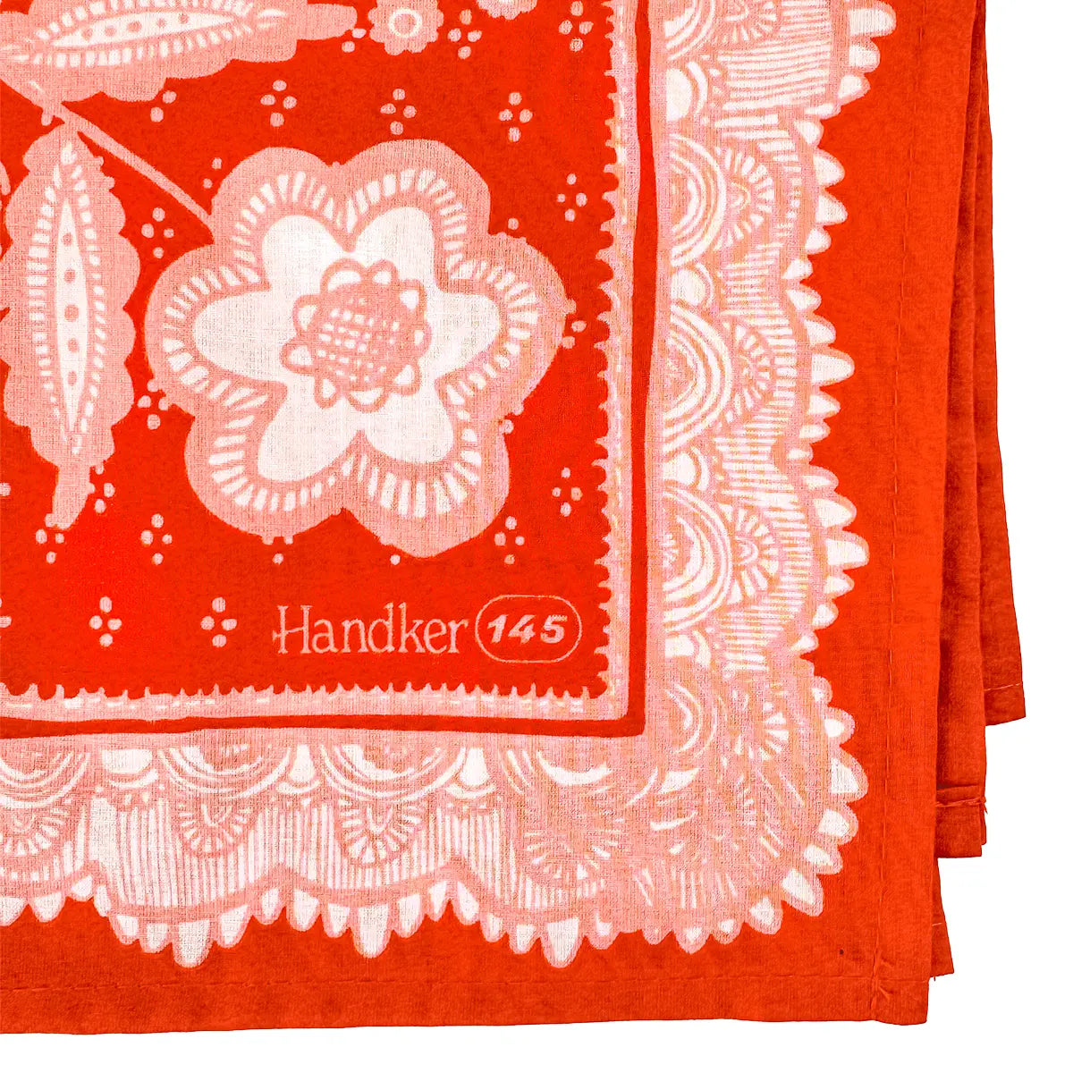 Red handkerchief with white floral pattern and 'Handker 145' branding.