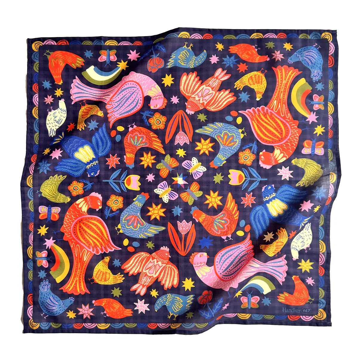 Colorful patterned fabric with birds and abstract designs on a dark background