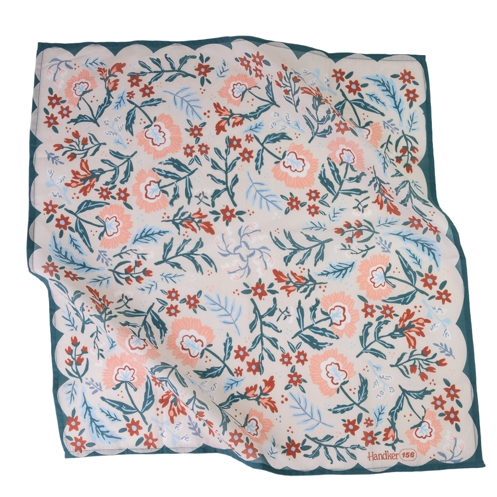 A square scarf with a scalloped edge, featuring a hand-drawn style botanical pattern in coral, teal, and light blue on a cream background, with a dark teal border.