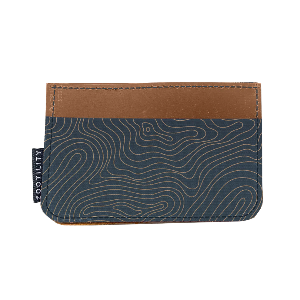 Slim leather wallet with an elastic pocket decorated in a navy topographical design