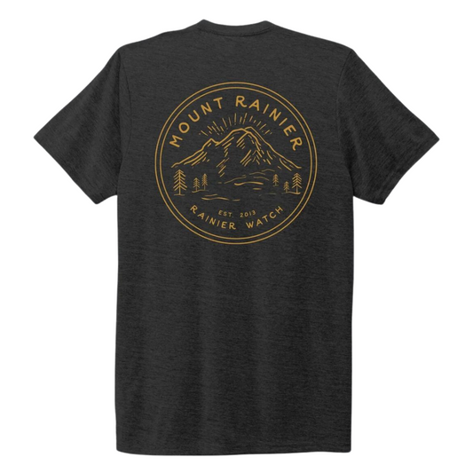Grey tshirt with circlular yellow design featuring mount rainier and the words Mount Rainier large on the back of the shirt
