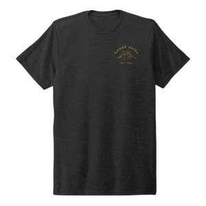 Grey tshirt wil small yellow logo on the left side featuring a mountain and the text Rainier Watch