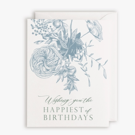 White card and envelope with "Wishing you the happiest of birthdays" in blue script type with blue flowers above