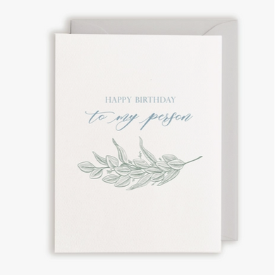 White card with grey envelope. Text in blue 