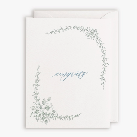 White card and envelope with "congrats" in script font with floral boarder.