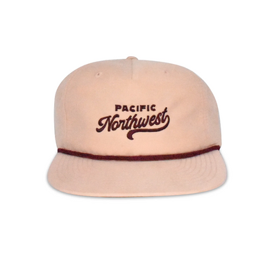 Light peach flat billed hat with maroon text that says Pacific Northwest