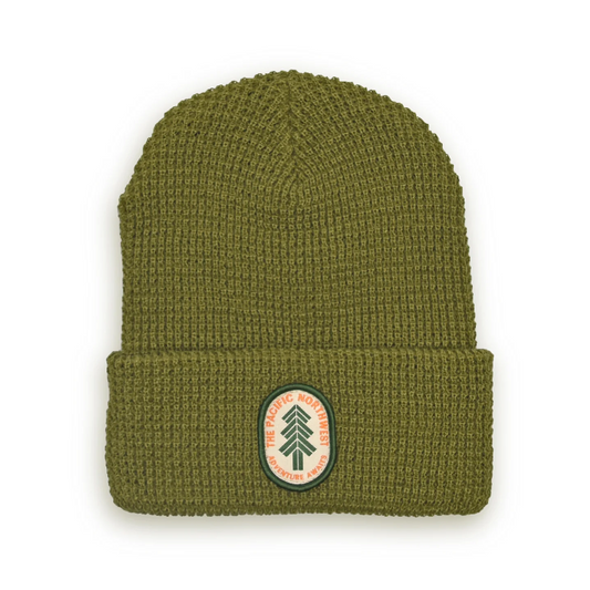 Olive Green beanie with small oval patch on the front that says "The Pacific Northwest"