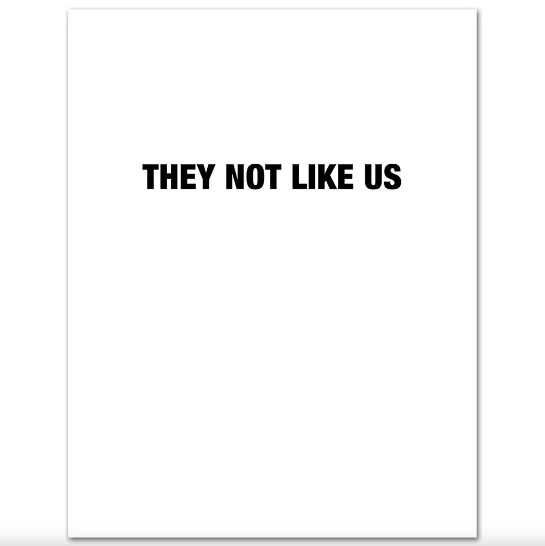 Interior of white card with black text saying "They Not Like Us"
