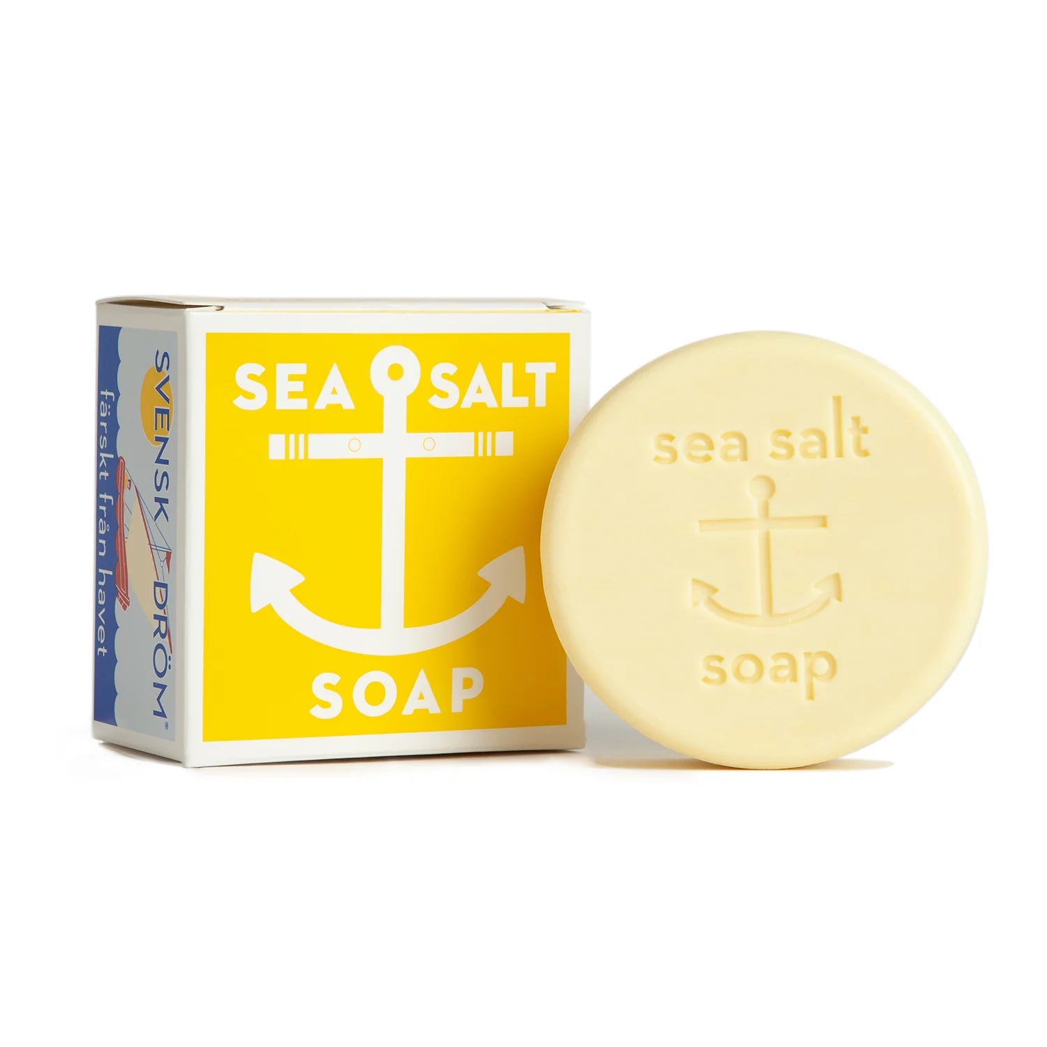 Round lemon sea salt soap with packaging. Both are yellow with an anchor. 
