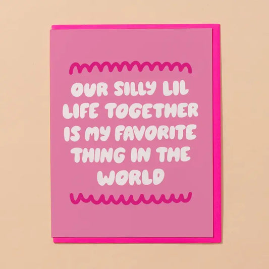 Pink card with white text on a beige background