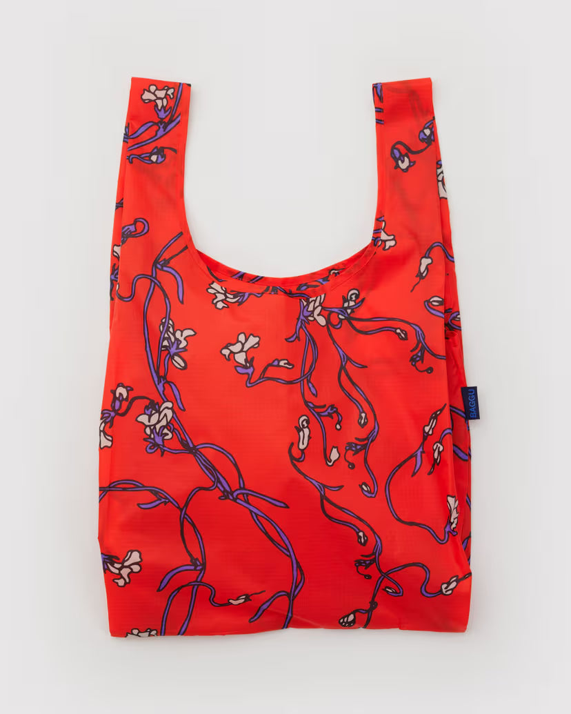 Red reusable bag with floral pattern on a white background
