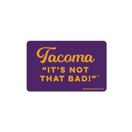 Purple sticker with gold text 'Tacoma It's Not That Bad!' 