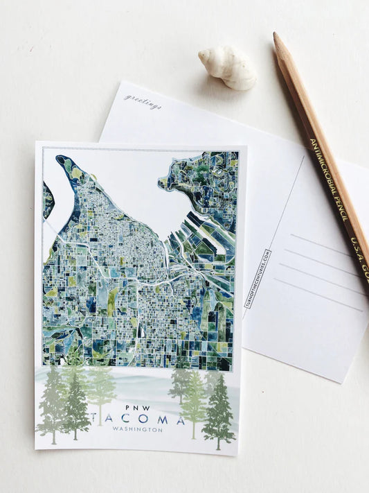 Map postcard of Tacoma with a pencil and envelope on a light background
